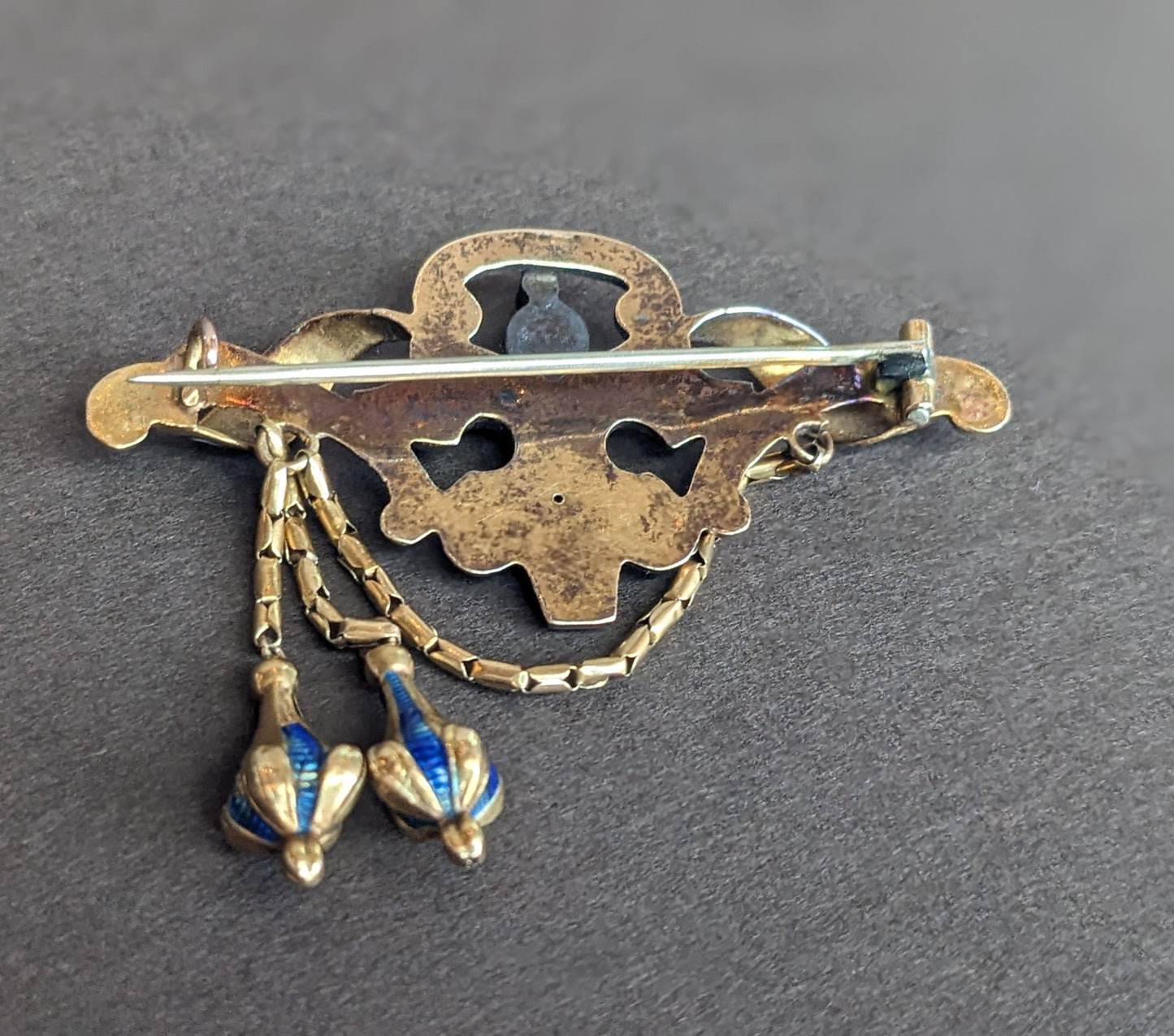 14k Gold, Blue and White Enamel Brooch with Foil Backed Garnet Stone