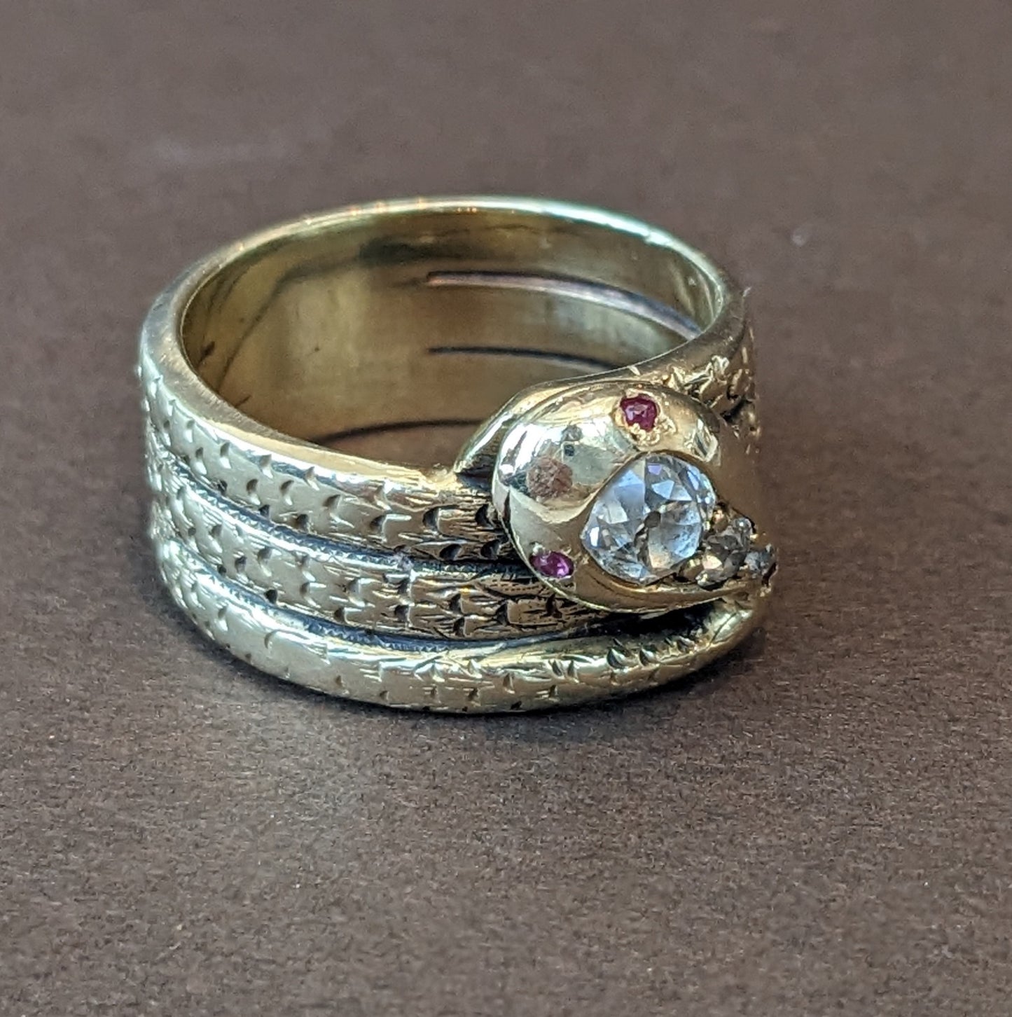 Heavy 18k snake ring with mine cut diamonds head