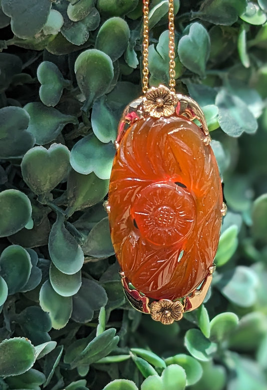 large carved carnelian pendant and chain