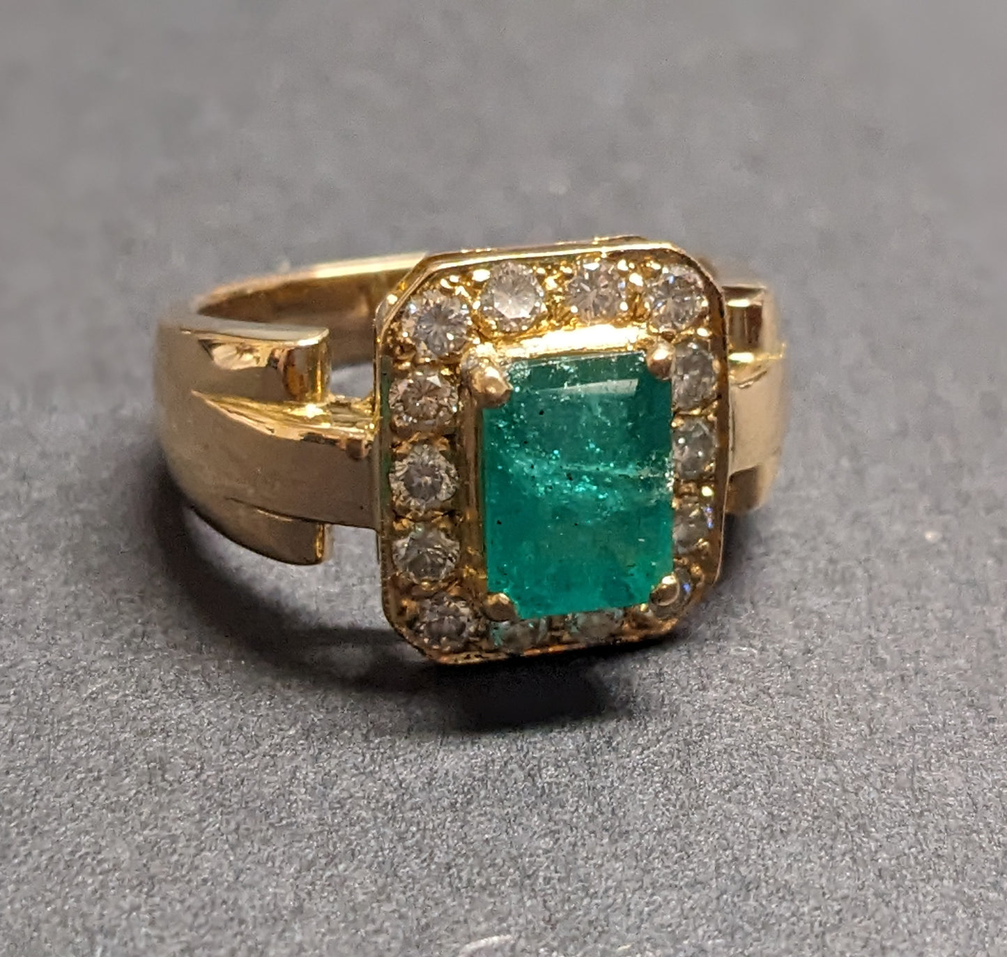 18k Emerald cut emerald with diamond halo