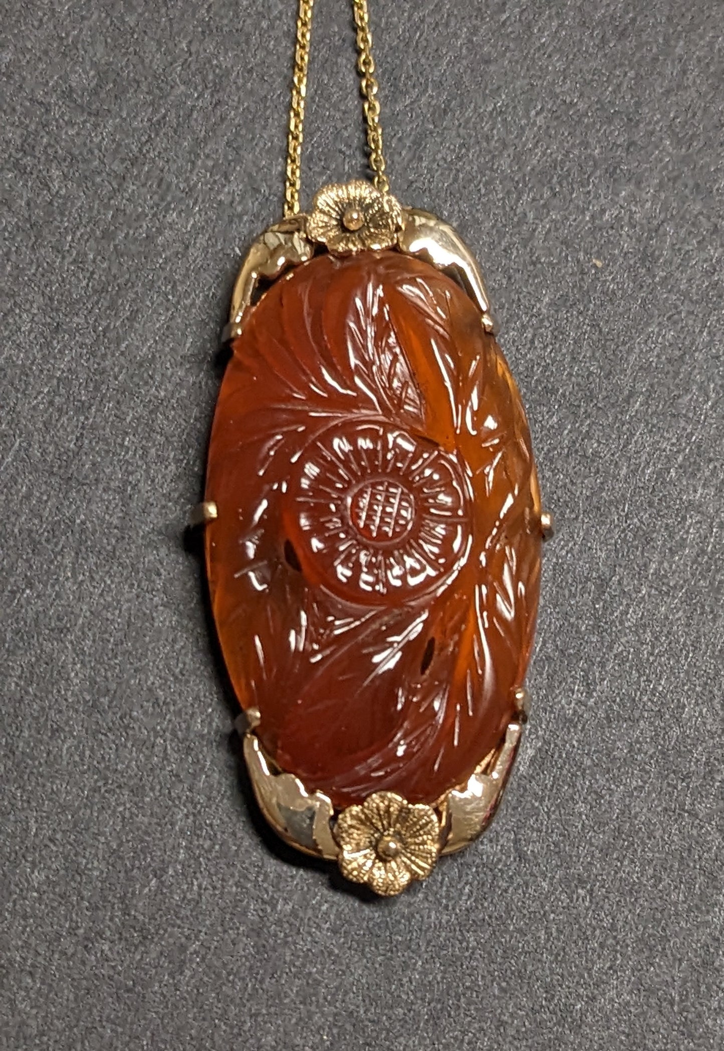 large carved carnelian pendant and chain