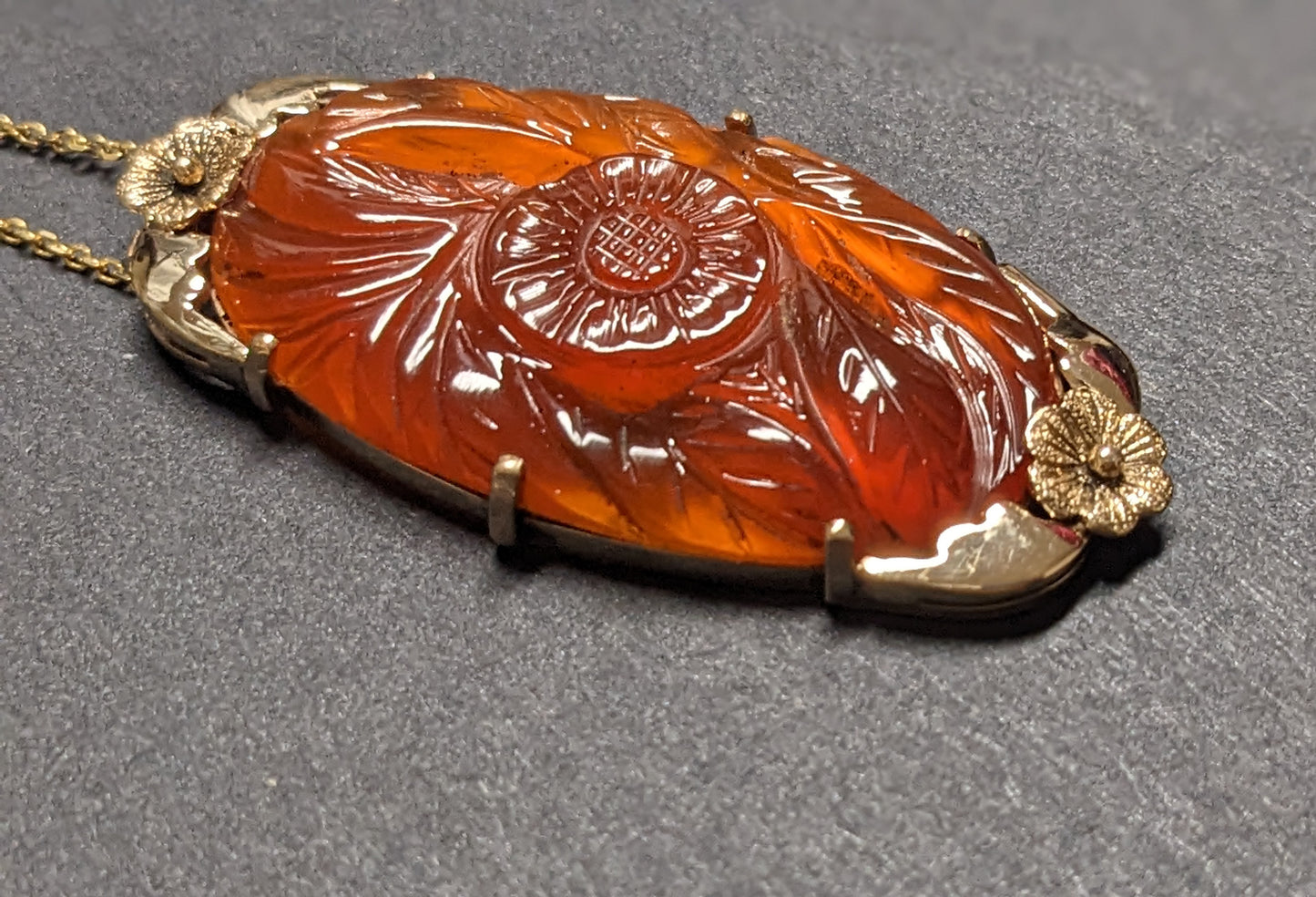 large carved carnelian pendant and chain