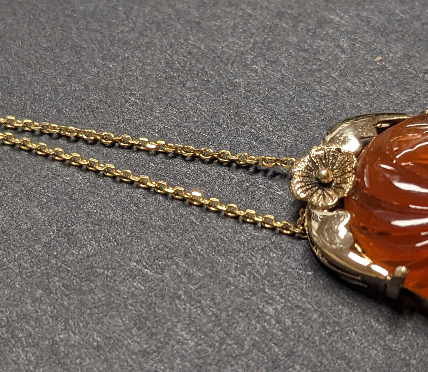 large carved carnelian pendant and chain