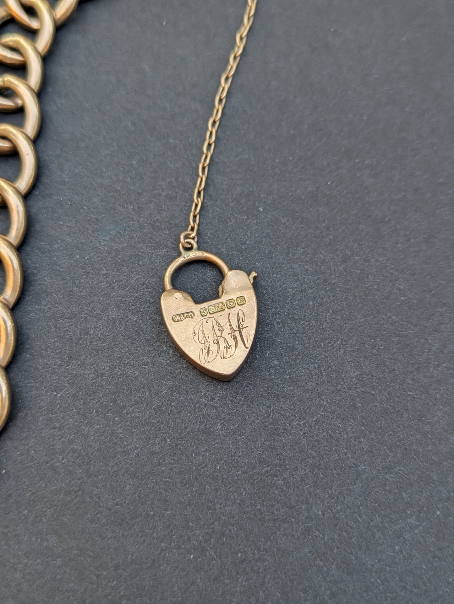 Wide Open 9k Curb Bracelet with Heart Locket