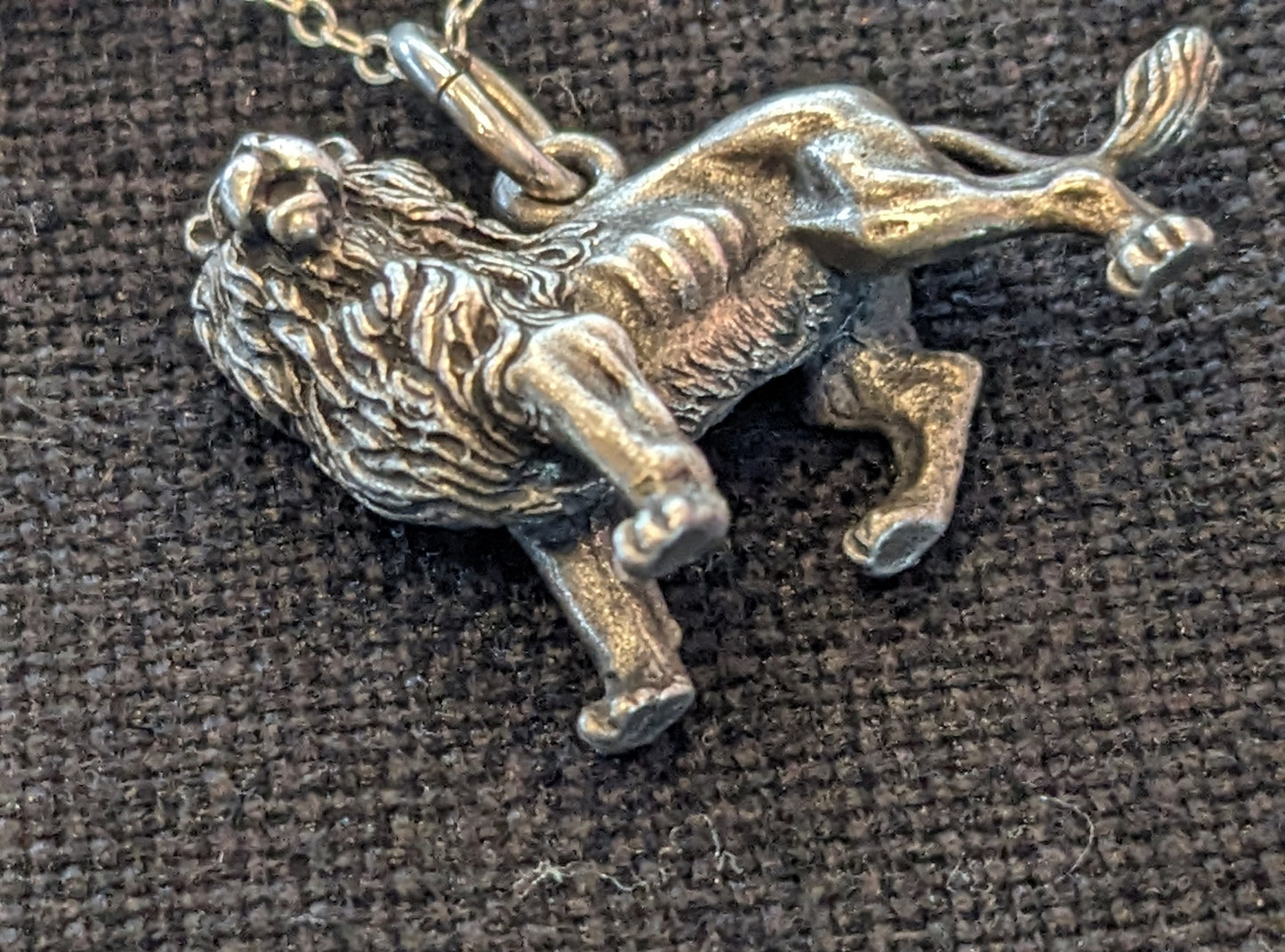 Large silver lion on grey pearl necklace