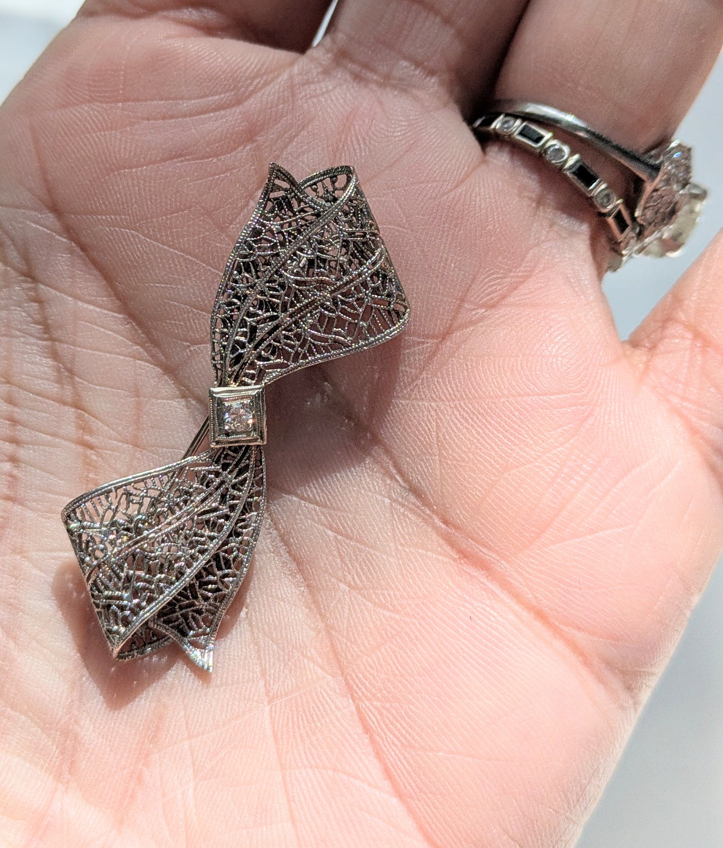White Gold Filgree Bow Brooch with OEC Diamond