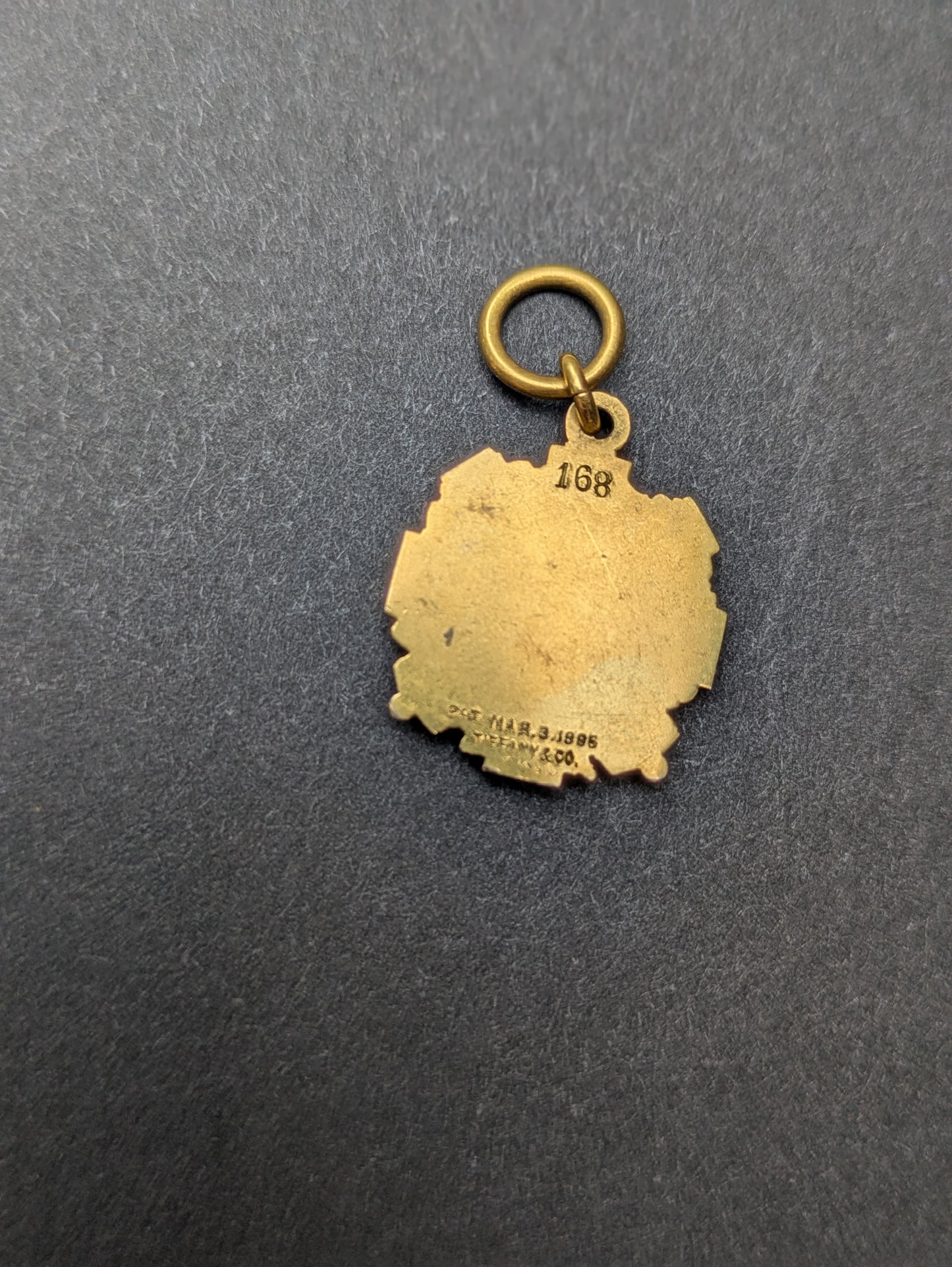 Tiffany + Co 1895 18k "7" Badge Charm