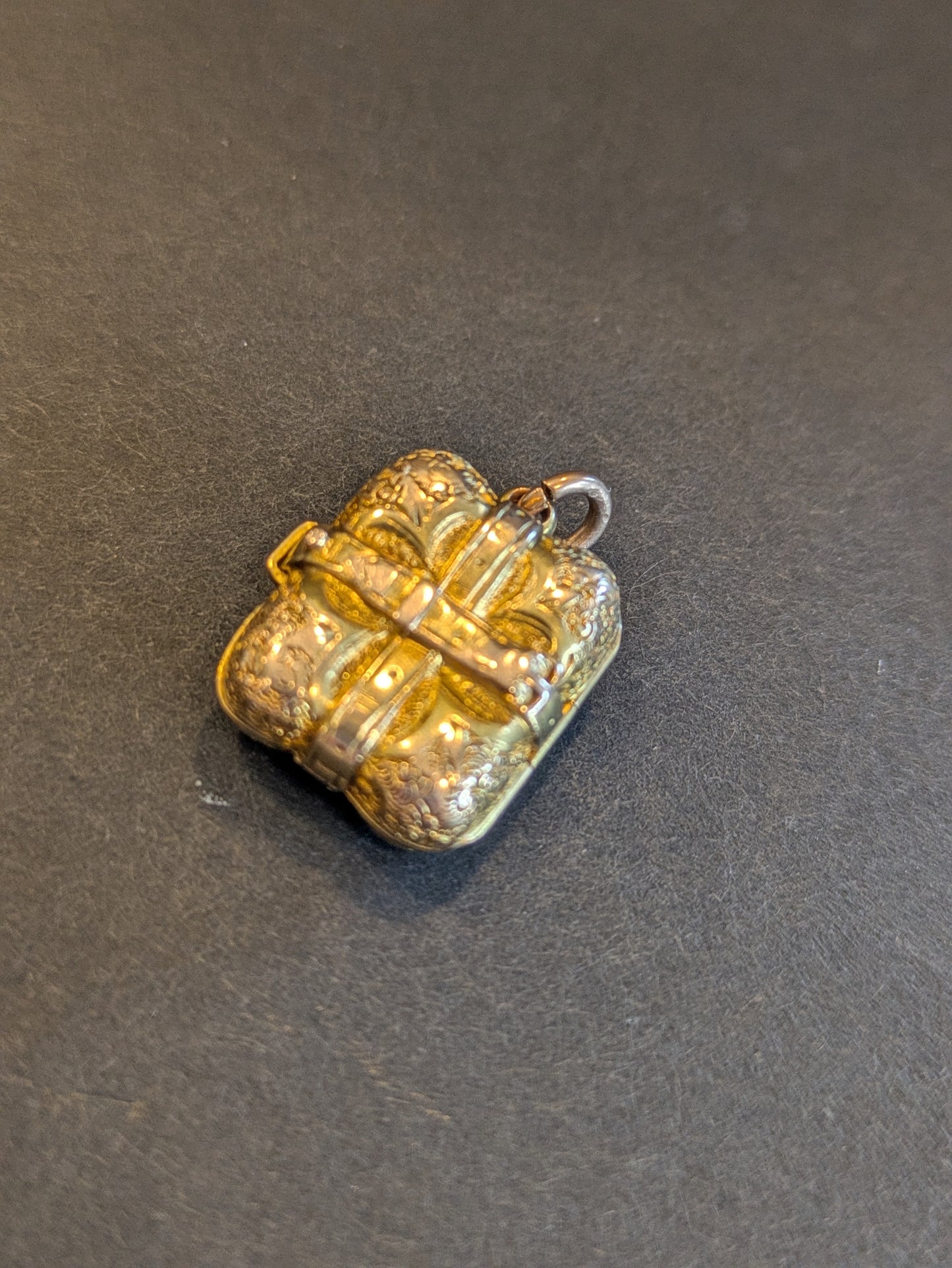 18k English Repousse Buckled Locket with hand chasing
