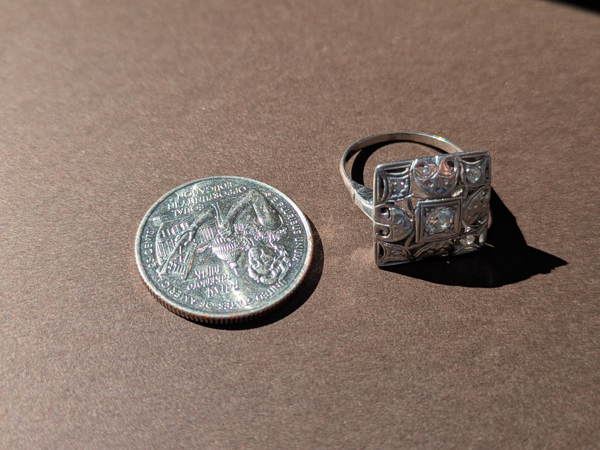 DIAMOND CENTERED FILGREE POSTAGE STAMP RING IN 14K WHITE GOLD