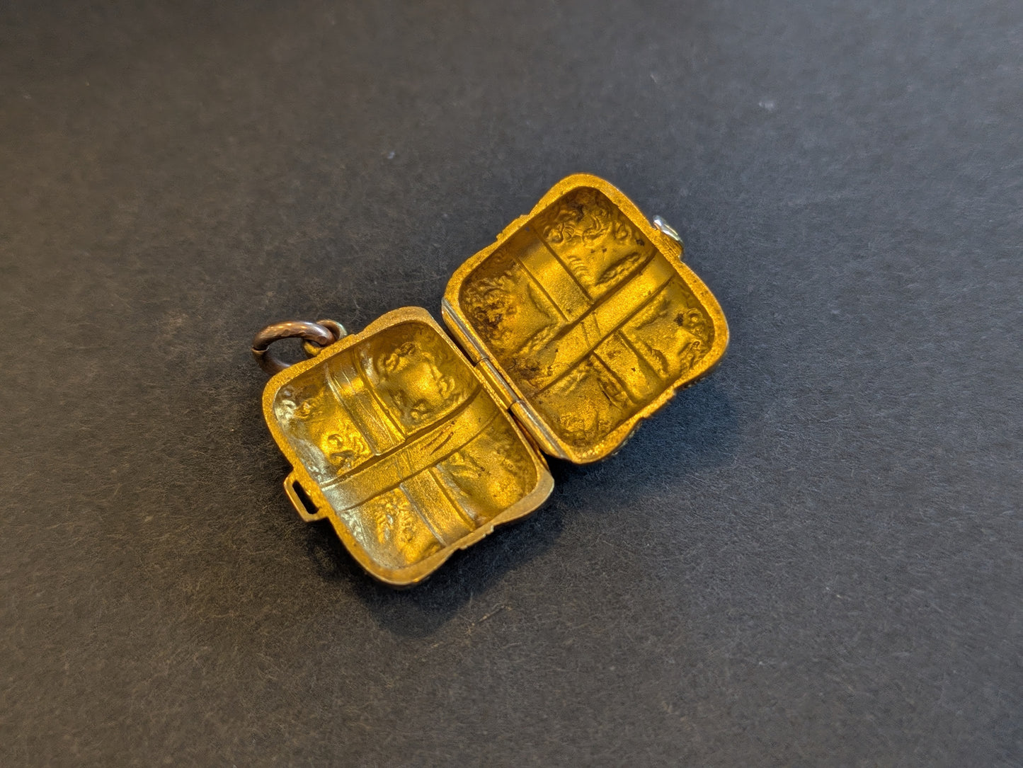 18k English Repousse Buckled Locket with hand chasing