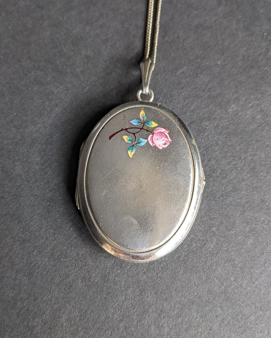 Large silver locket with enamel rose and monogram