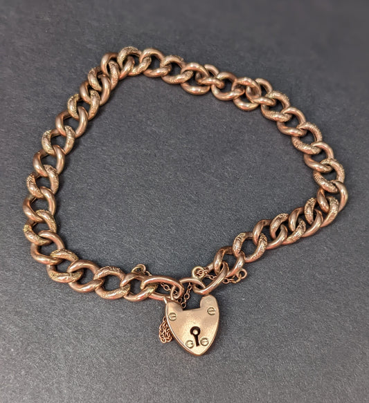 Rose gold curb chain bracelet with heart padlock