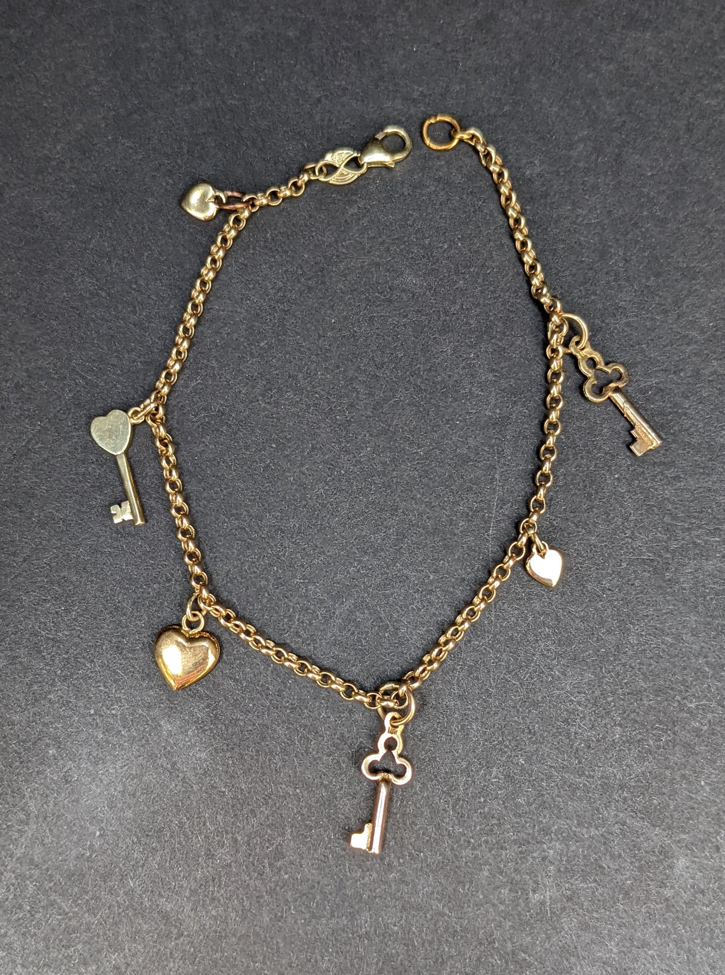 14kt antique key and vintage hearts charm bracelet