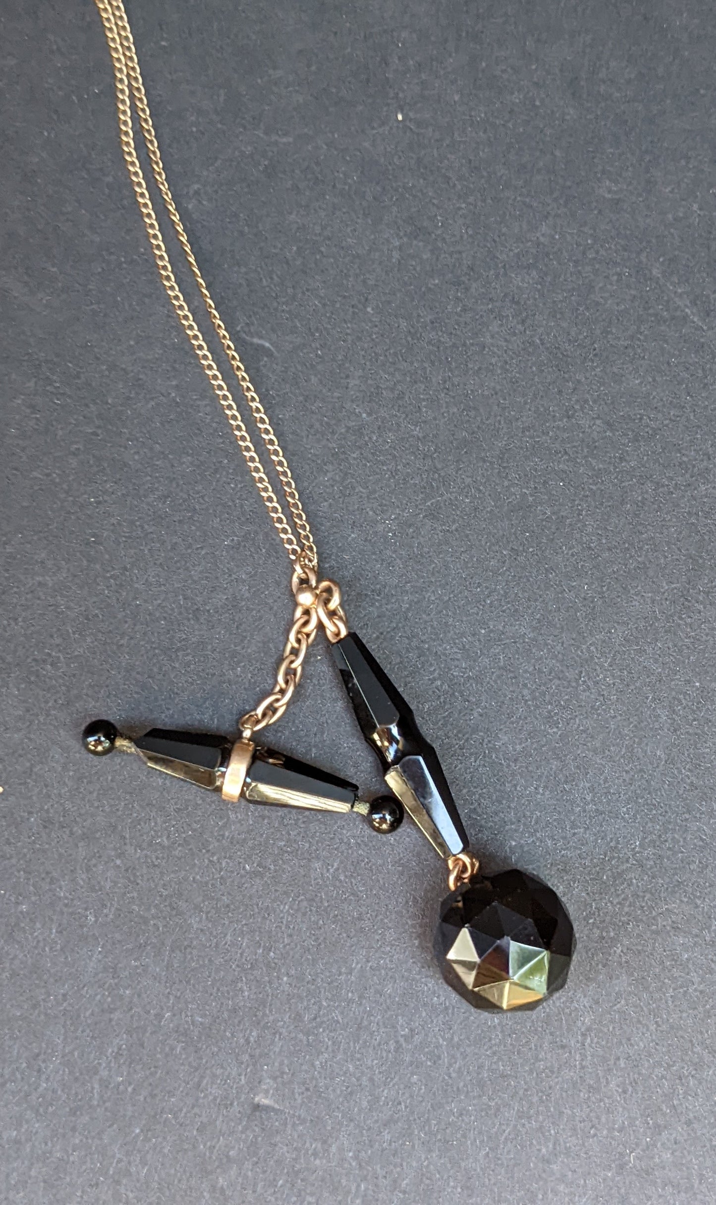 Late Victorian 14K yellow gold carved black onyx watch fob on 9ct chain