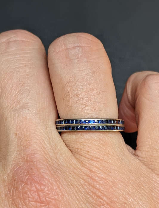 A pair of sapphire and white gold eternity bands