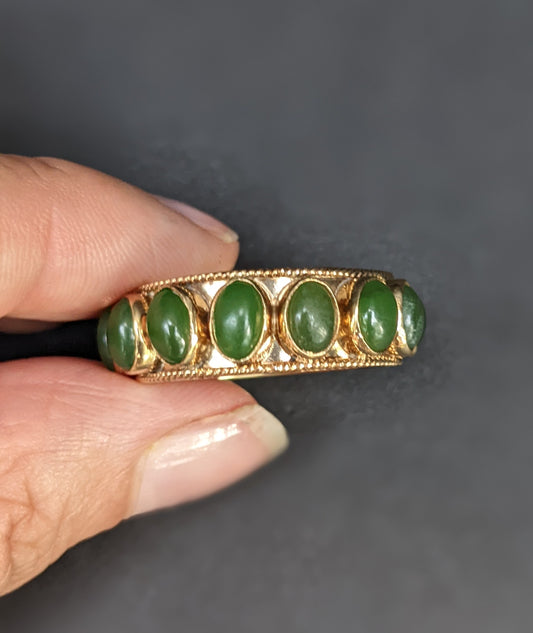 Wide bezel set jade eternity band