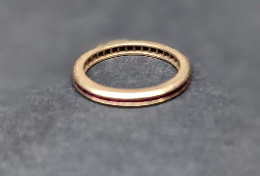 Ruby and yellow gold eternity band