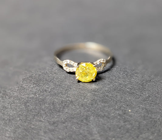 Yellow sapphire and white diamond ring