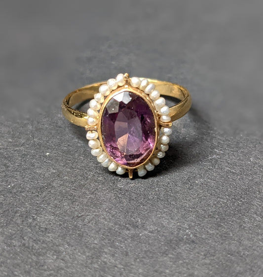 Wired seed pearls surrounding dark amethyst ring