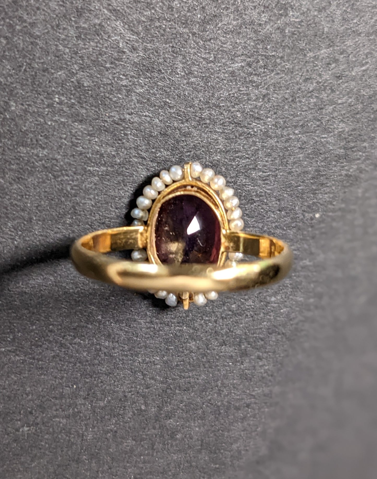 Wired seed pearls surrounding dark amethyst ring