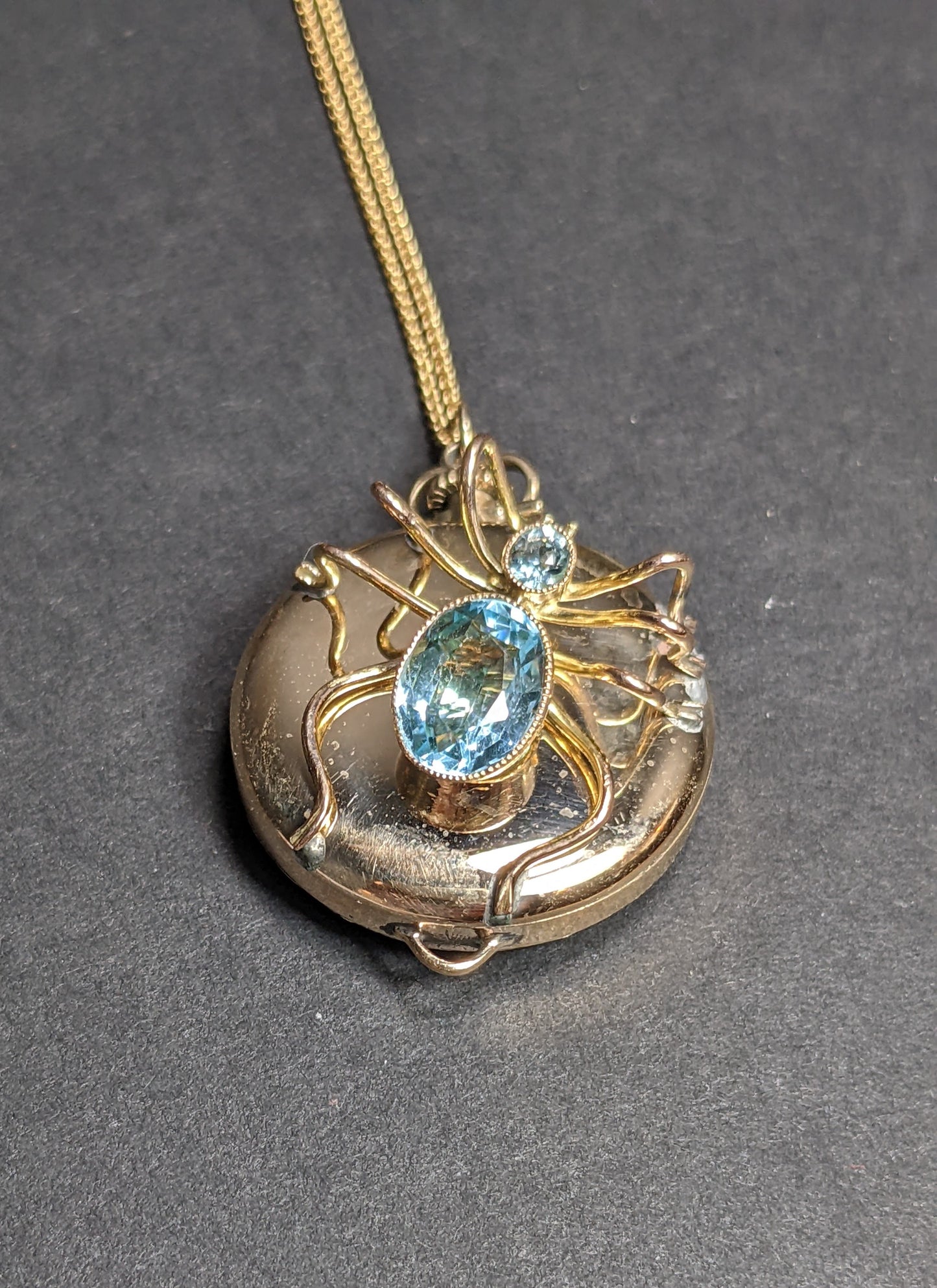 Spider on antique watch with gold chain