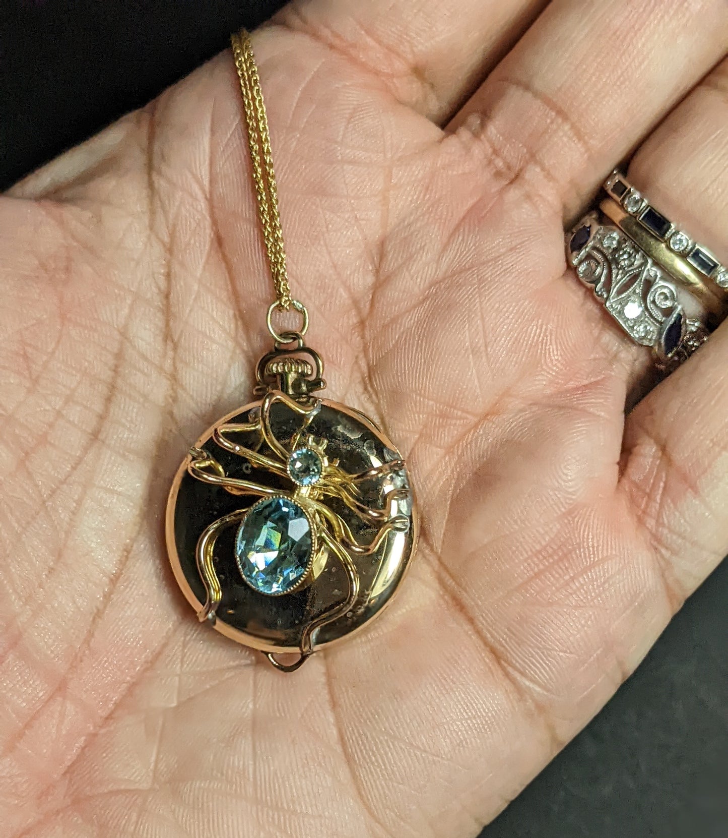 Spider on antique watch with gold chain