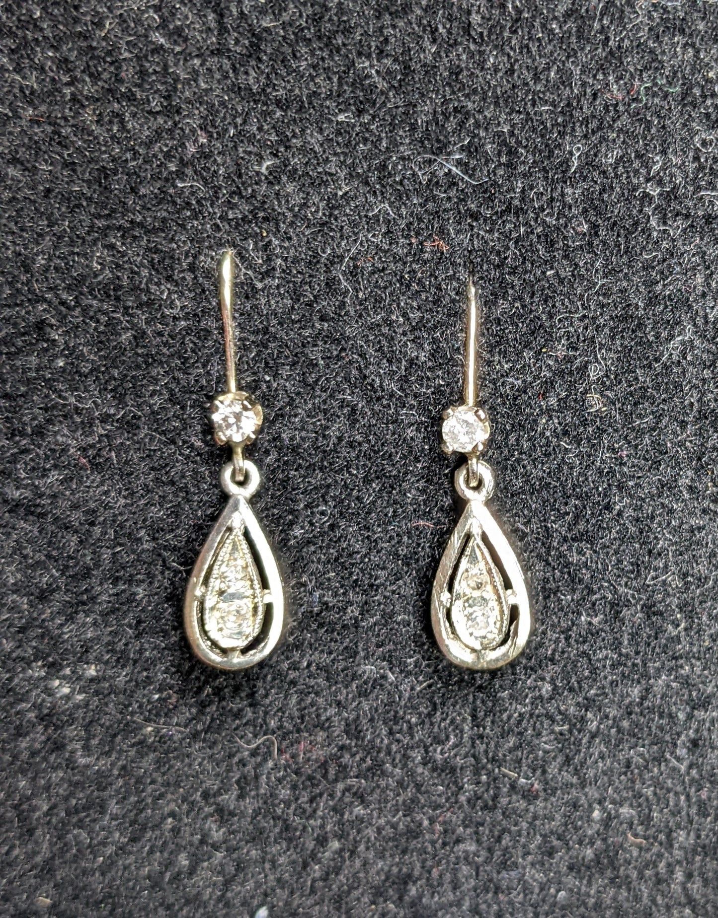 Tear drop diamond earrings on diamond leverbacks