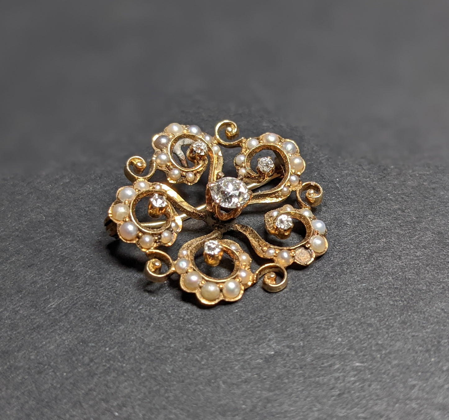 Victorian era 14k Starburst with Seed Pearls and Mine Cut Diamond