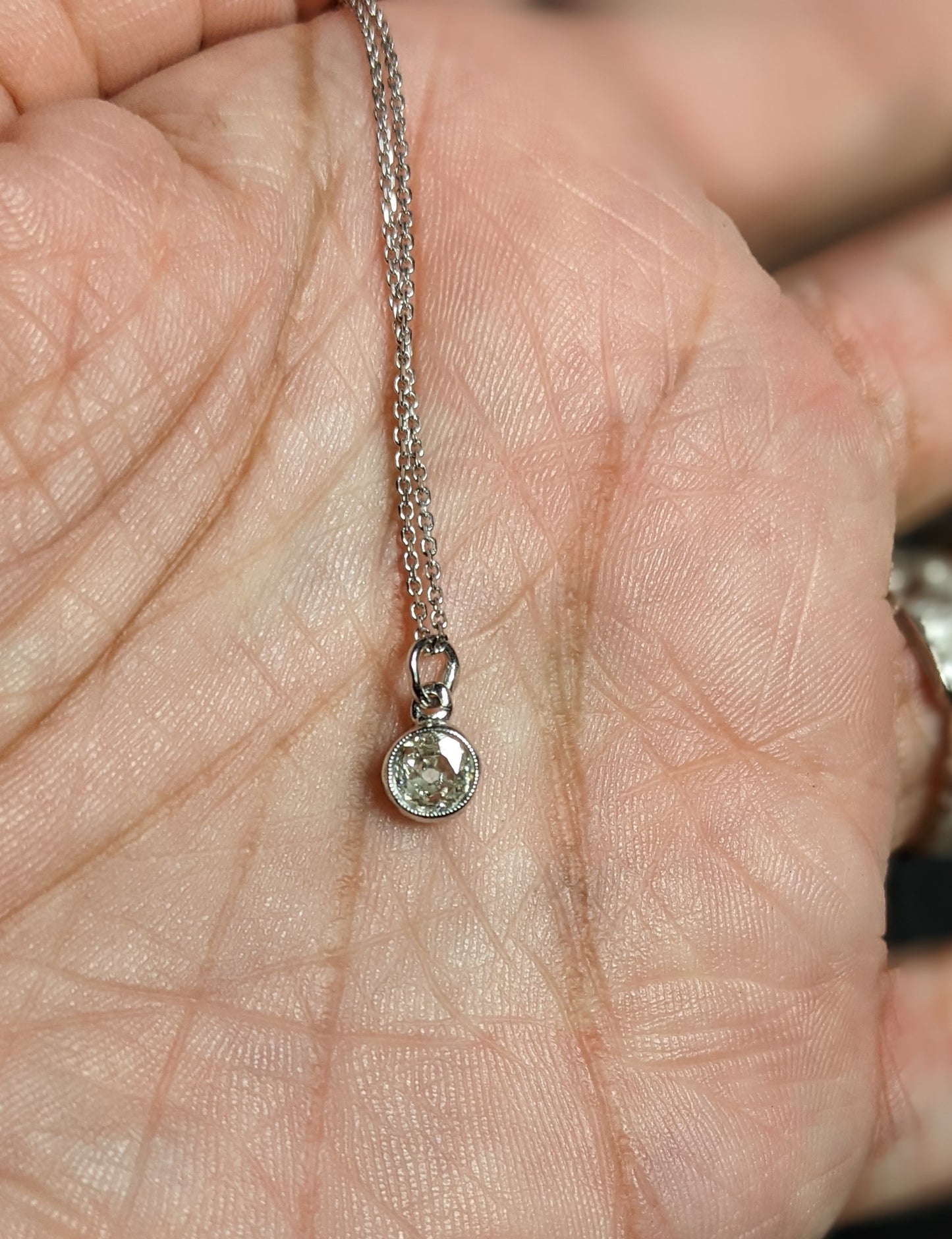 Old European cut diamond in original bezel on 14k white gold chain