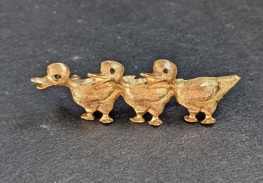 Ducks in A Row Brooch with Sapphire Eyes